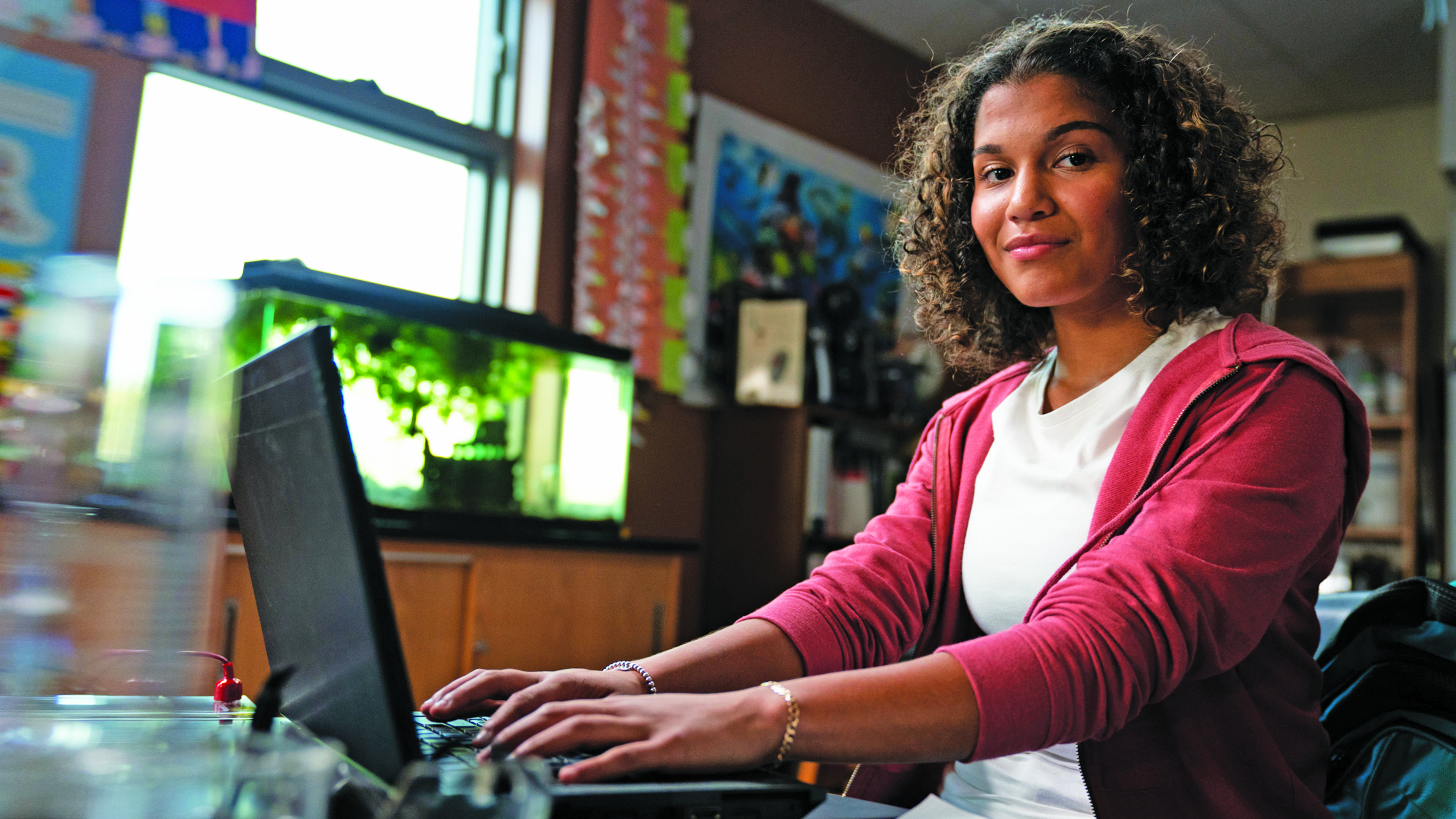 A young student uses a computer to do schoolwork