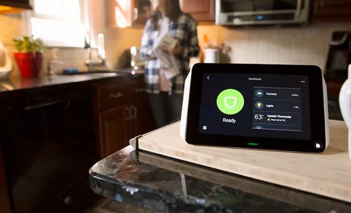 A tablet displays the Xfinity Home app