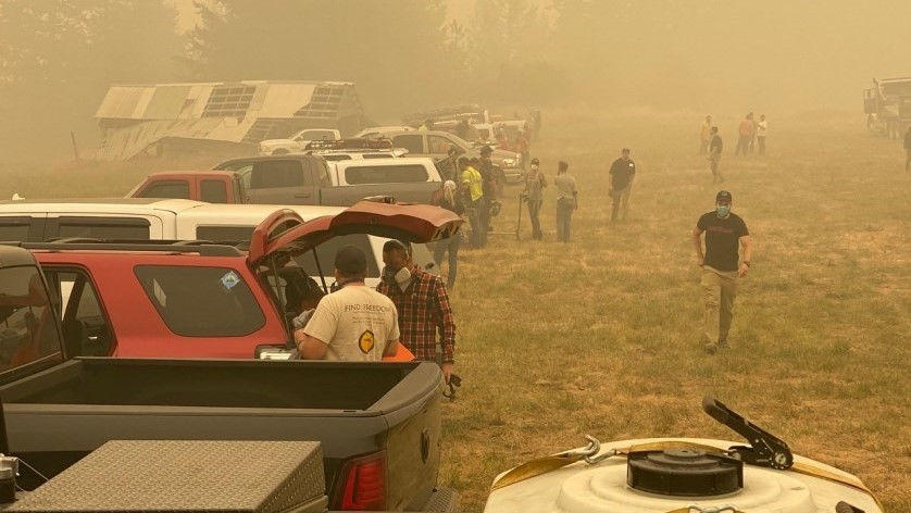 Volunteers gathered in a parking lot.