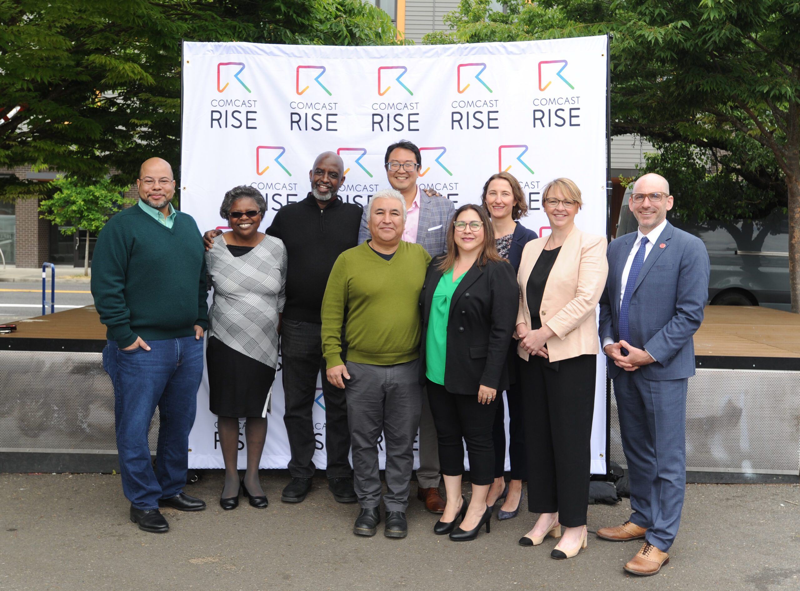 Comcast and Portland representatives pose for a photo.