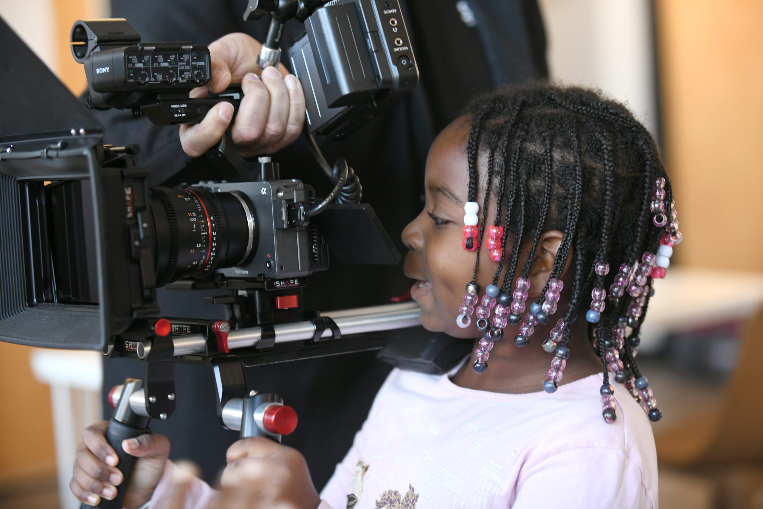 A child with a camera.