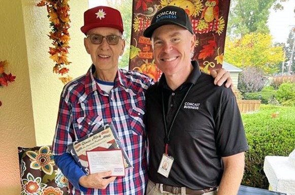 Jerry Lauzon with a Comcast employee.