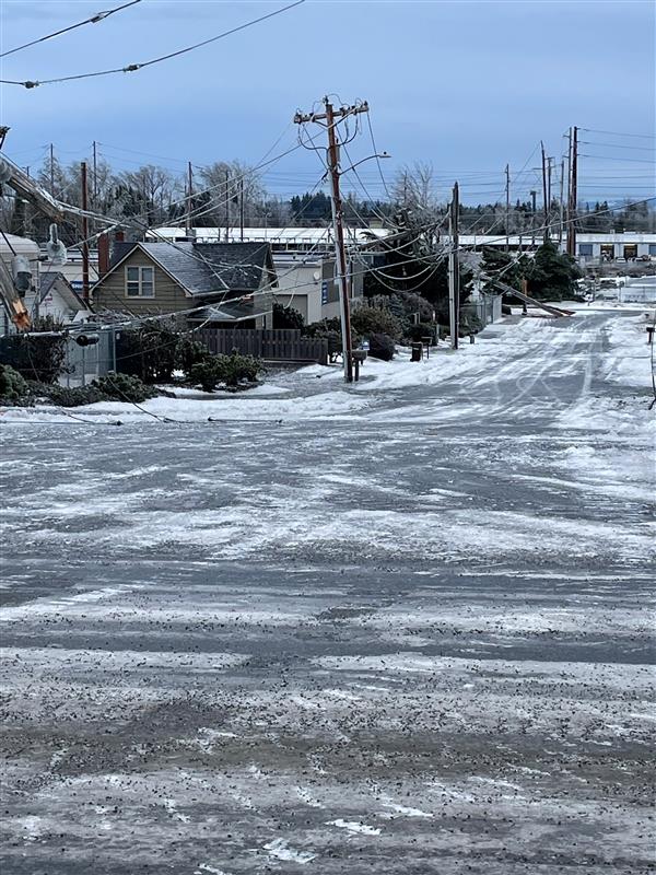 Icy roads and downed power and cable lines.