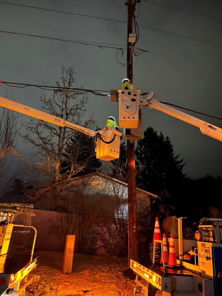 Comcast technicians working in the field to restore service.