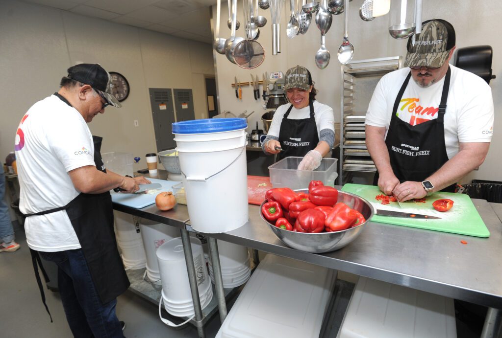 Volunteers make food